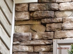 freezing-damage-to-manufactured-stone-veneer-where-water-has-ran-down-the-front-wall