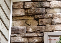 freezing-damage-to-manufactured-stone-veneer-where-water-has-ran-down-the-front-wall